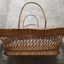 Rectangular basket with solid base, widening to top with handles each side