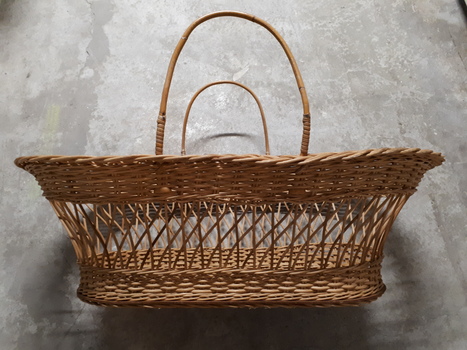 Rectangular basket with solid base, widening to top with handles each side