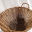 Cane oval basket with cane handles at either end