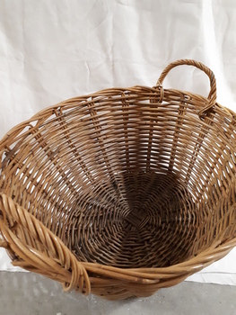 Cane oval basket with cane handles at either end