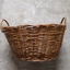 Cane oval basket with cane handles at either end