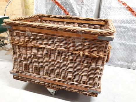 Large wicker basket on wheels