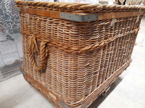 Large wicker basket on wheels