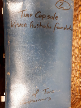 Top of suitcase labelled one of two containers