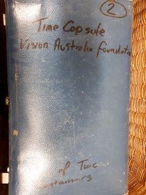 Top of suitcase labelled one of two containers