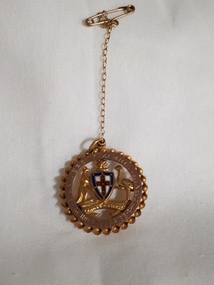 Australia coat of arms inside circle with engraving around edge