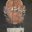 Close up of Ellams logo on black metal case