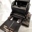 Machine opened up with paper feed and rotary barrel shown