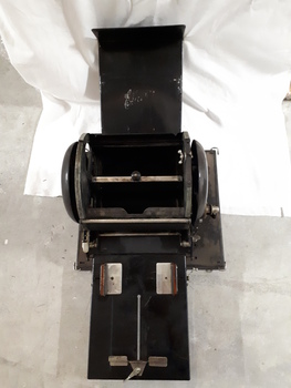 Paper feed tray and rotary barrel on duplicator shown