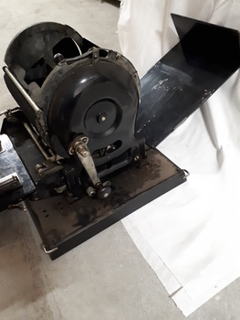 Paper feed tray and rotary barrel on duplicator shown