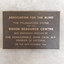 Metal plaque with raised lettering for Vision Resource Centre