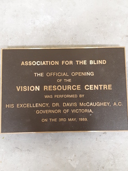Metal plaque with raised lettering for Vision Resource Centre
