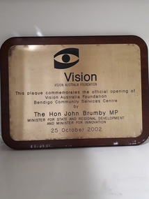 Bronze coloured plaque with VAF eye logo at the top