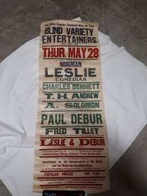 Rectangular paper with red, green and blue lettering