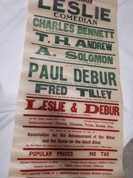Rectangular paper with red, green and blue lettering