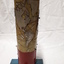 Metal cylindrical map with tactile markers showing the Americas