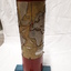 Metal cylindrical map with tactile markers showing Atlantic Ocean