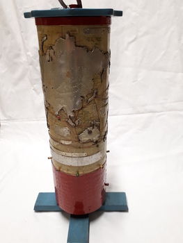 Metal cylindrical map with tactile markers showing Indian Ocean, Asia and Australia