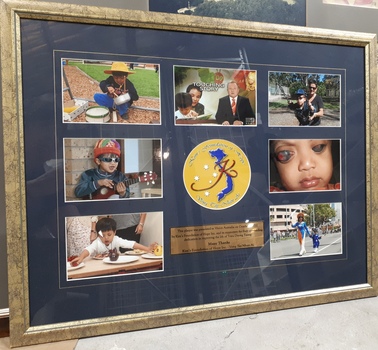 Seven coloured photographs of Trieu Duong Tuong framed