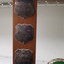 Metal plates on sides of trophy