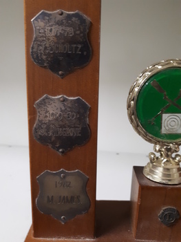 Metal plates on side of trophy