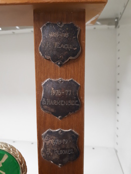 Metal plates on side of trophy
