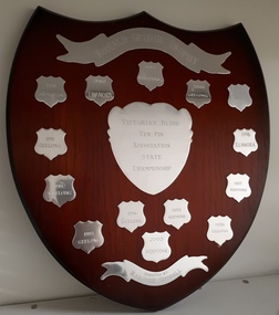 Wooden shield with 14 mini shields and banners at top and bottom