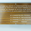 Laminate board with woodgrain finish and etched white lettering