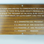 Laminate board with woodgrain finish and etched white lettering
