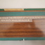 Laminate board with woodgrain finish and etched white lettering - on rear of board 