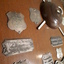 Close up of silver plates on wooden shield
