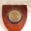 Wooden shield with inscribed metal circle