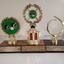 Three small trophies consisting of a wood veneer base, nameplate and circular pieces on top, two with filled in discs