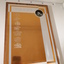 Laminate board with golden and silver coloured engraved sheet attached