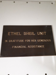Brown plaque writing bronze raised writing