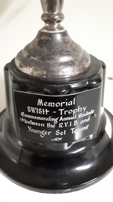 Black plate at base of trophy with white writing