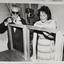 Two people working on a wooden frame