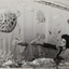 Woman feeling embroidered undersea mural