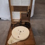Lid raised to reveal a record player inside the wooden box