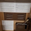 Lid raised to reveal a record player inside the wooden box