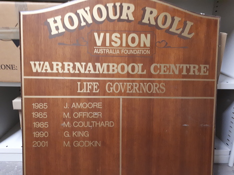 Brown laminate board with adhesive lettering