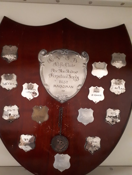 Wooden polished shield with silver nameplates