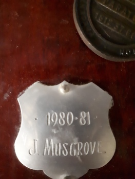 Winner's name inscribed on nameplate
