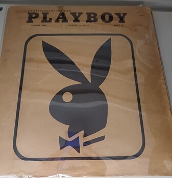 Brown paper cover with title at top and bunny wearing a bow tie