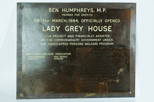 Brown metal plate with white engraving