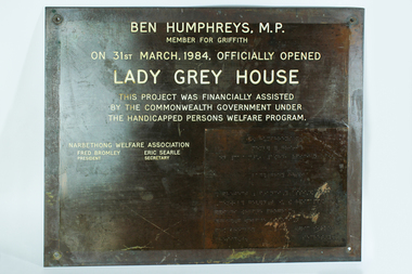 Brown metal plate with white engraving