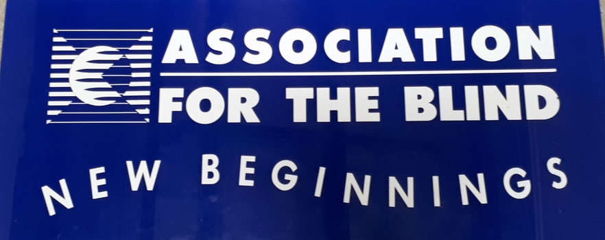 Blue rectangular sign with white writing and AFB logo
