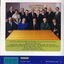 Board of Directors sit or stand behind a table: Draffin, Lustig, Moule, Proctor, Leahy, Upon, Knight, Daubney, Malycon, Cocks, West, Crook, Gorton, Cook, Wurm.