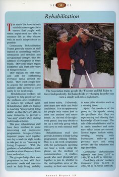 Winsome and Bill Bake grapple with overhead branches as they walk along the footpath with their white canes.