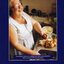 Lorna Heyter listens to an audio book whilst peeling potatoes in her kitchen.